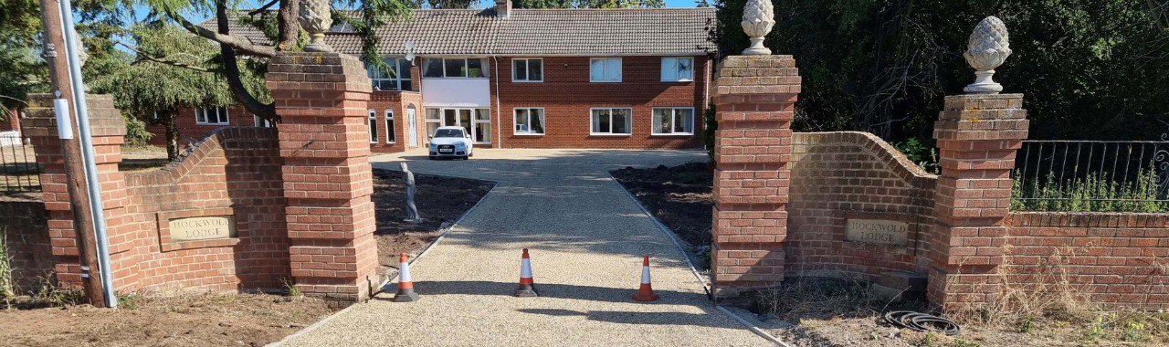 This is a photo of a newly installed chip and tar driveway, installed by Royston Driveways